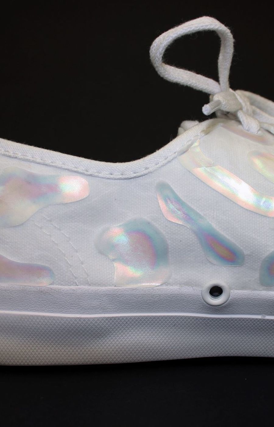 A white sneaker with glitter in the surface