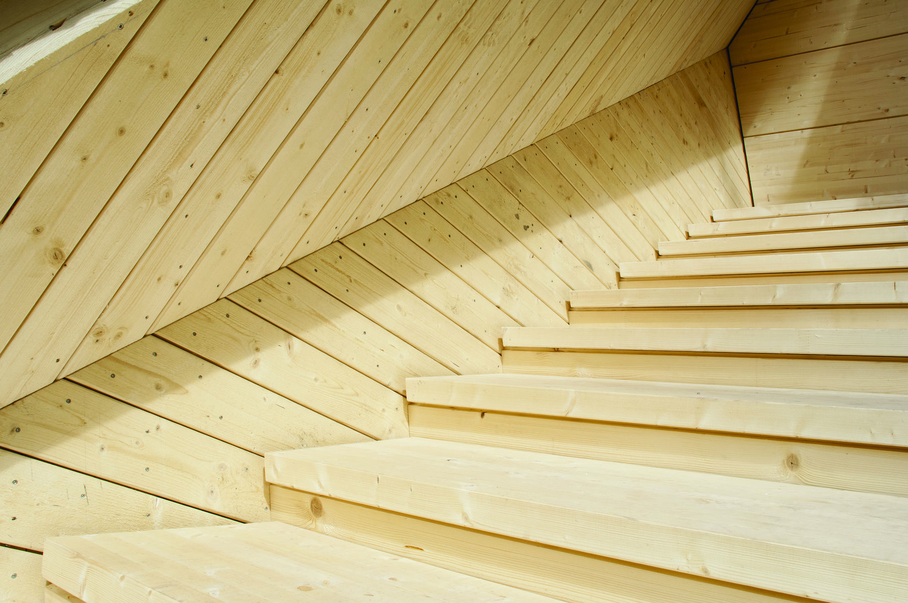 The terrace stairs of the Koe smoke sauna invite to experience the traditional smoke sauna in a new way. The experimental character of Alvar Aalto’s buildings at the site has been an inspiration for the project. Photo: Anne Kinnunen