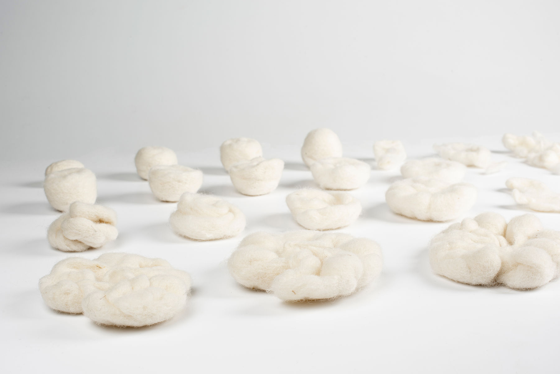 different shaped pieces of white wool