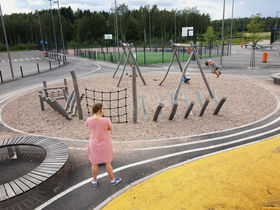 playground with pavement, sand and wood