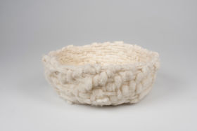 a basket made of white wool