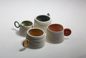 A set of colourful 3D printed clay cups