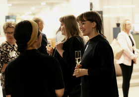 A student of Contemporary Design Sonja Dallyn discussing with a colleague.