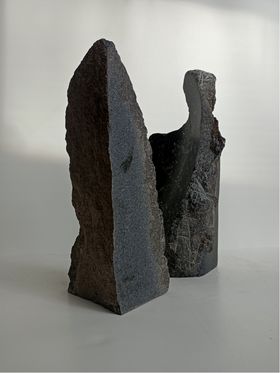 A sculpture proposal made of granite, two slabs sharply pointing upwards.