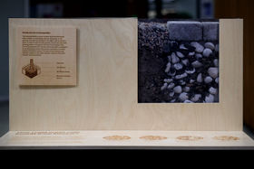 Front view of an exhibition element of a section of an urban tree soil structure with biochar