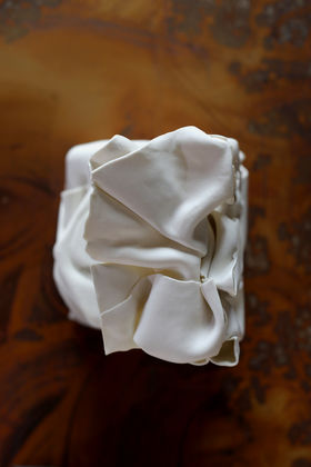 White piece of clay folded in on itself
