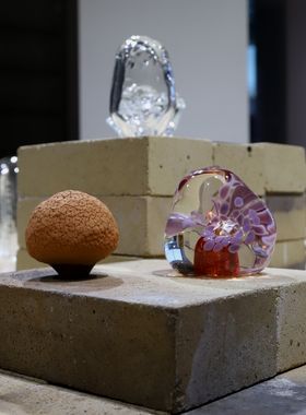 Two glass sculptures and one ceramic one