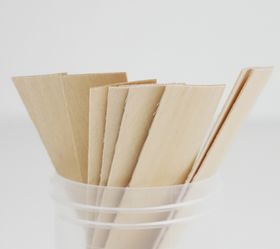 Wood veneer strips in a cup
