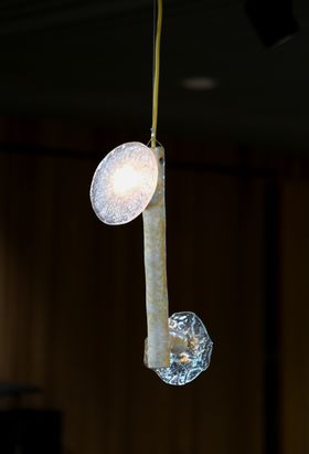 Pendant lamp with two snowflake patterned glass shades