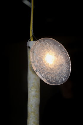 Detail image of the hanging light lit up