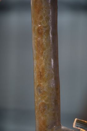 Close up image of the lamp base - orange in colour with a crystalised kind of texture
