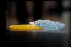 A flat, textured, yellow and blue glass piece