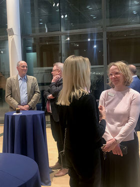 Happy people in Aalto University alumni get-together at the Embassy of Finland