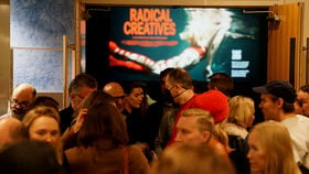 Happy people gathering together after Radical Creatives premier in the US
