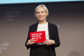 Falling Walls founder holding card