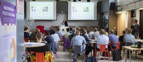 Audience listening to presentation at Aalto Sensors event in Design Factory
