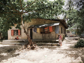 Woman, child and house in Zanzibar