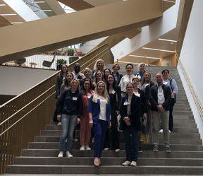 Erasmus+ Staff Training Days 2023  at Aalto. International participants standing at the stairs .