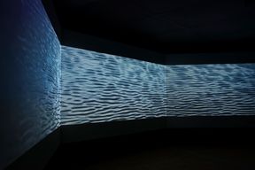 Three screen forming a long immersive video experience, water themed