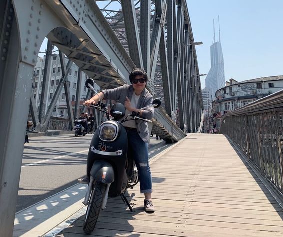School of Business alumni Li Xu on her motorbike in China.