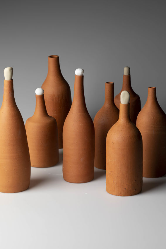 eight bottles made out of clay