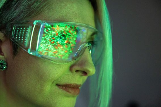 Colors reflecting on woman's research goggles