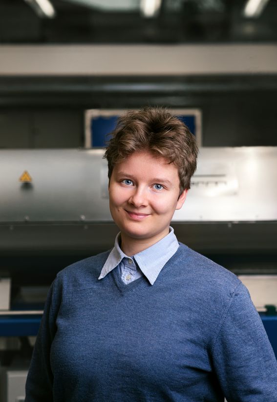 Helena Sederholm photographed in a lab setting, wearing a blue sweater.