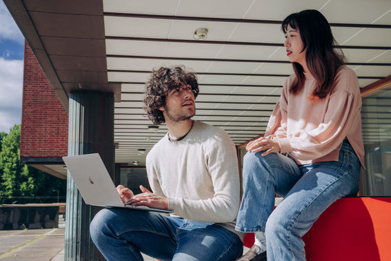 Man and woman working together with a laptop