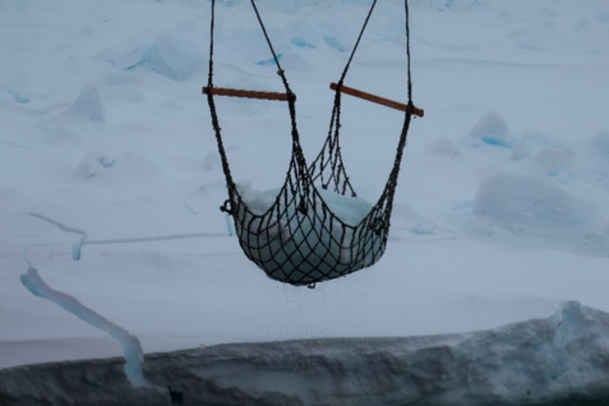 Fishing for ice in the Antarctic.