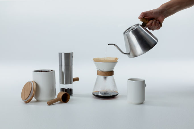 a set of ceramic and wooden objects for coffee making