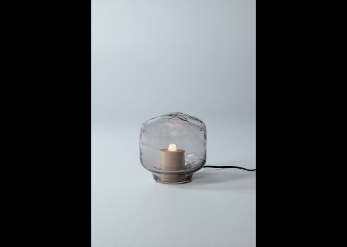 a bubble-like table lamp made of glass and wood