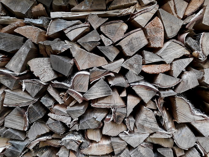Colour photograph of chopped, piled wood