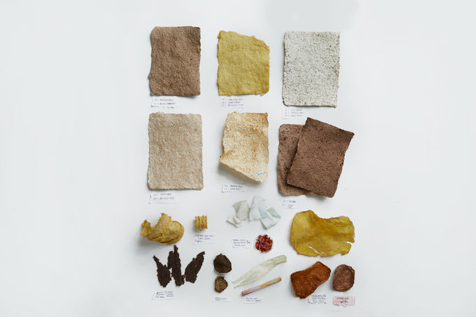 Portfolio photo of items produced through laboratory experiments during the Aalto University Summer School course Nordic Biomaterials with CHEMARTS. The times are laid out on a white background photographed from above. The items are different types of paper produced out of biomaterials and waste. 