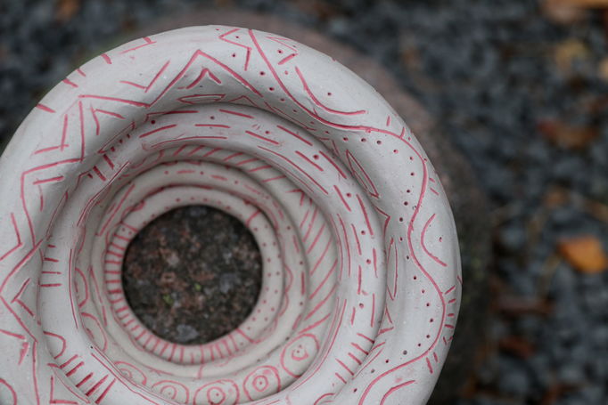 a top close-up of ceramic rings piled on a rock