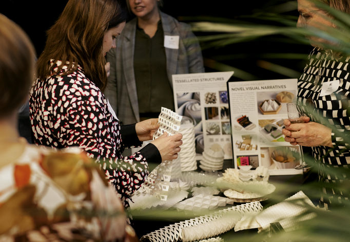 The doctoral school’s Cellugami -project tackles packaging challenges through origami designs. Kirsi Peltonen (right) University lecturer, Department of Mathematics and Systems Analysis, showing prototypes to Katariina Kemppainen, Metsä Spring (left).  