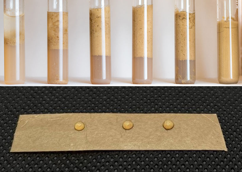 Two images: top 6 test tubes with differing amounts of water and brown particles in layers, bottom: brown composite material with water droplets balanced on the surface
