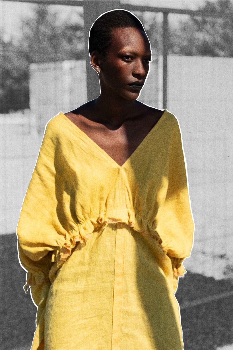 Model wearing long-sleeved yellow dress from the BioColour Linen collection