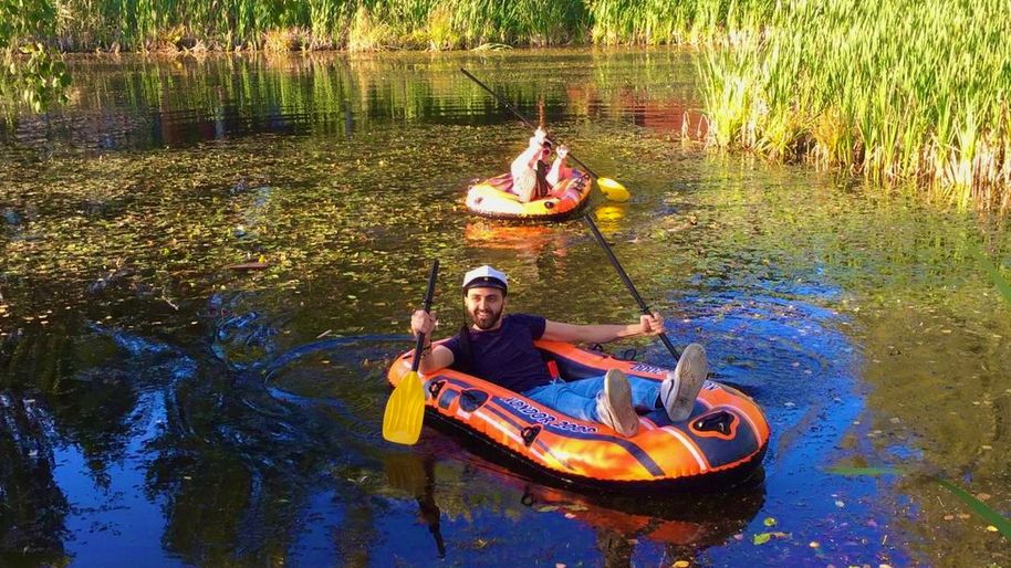 Adel in a float boat in a lake in Finland