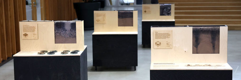 Banner of exhibition boxes for the Helsinki Biochar Project