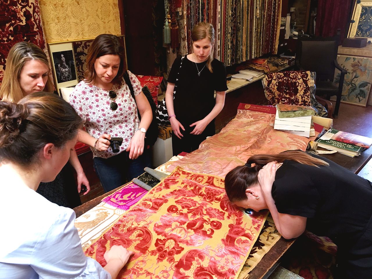 Refashioning team studying silk fabrics at Tessitura Luigi Bevilacqua. Photo: Refashioning the Renaissance project, 2018.