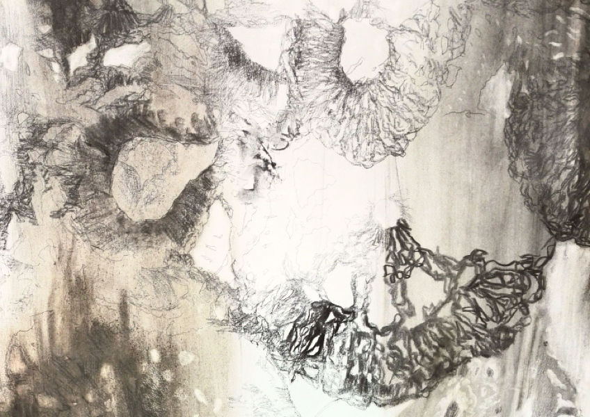 Detail of the artist's work comprised of mark-making made with charcoal, ash, pencil on paper / OHP, crochet pieces