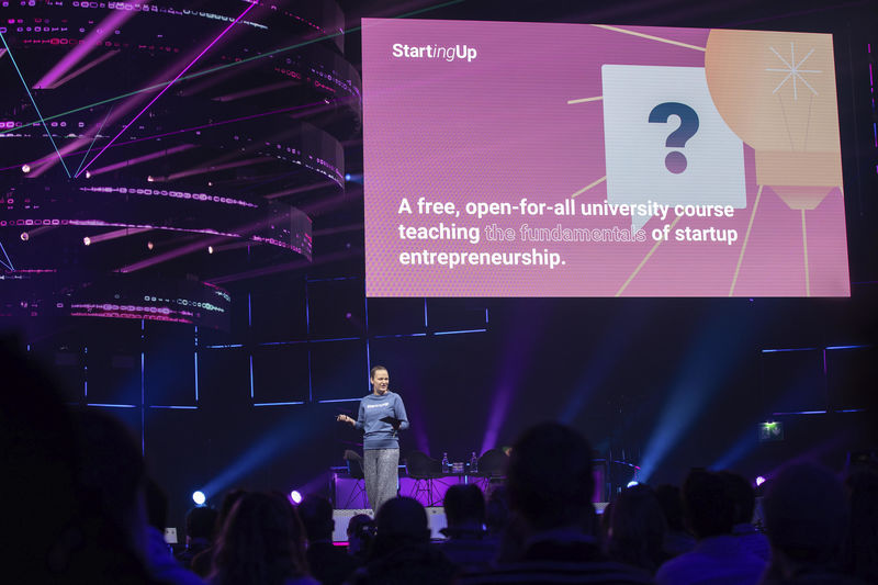 A woman stands on a stage at Slush in 2019